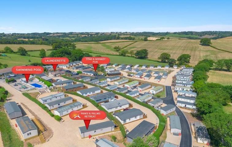 Aerial view of Springfield Retreat park with pool, launderette, and pub marked